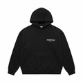 Black Fear of God Essentials FW24 hoodie with small contrasting chest logo, front view